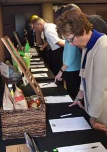 Understanding the Times: Guests consider their bids at the 2016 Silent Auction